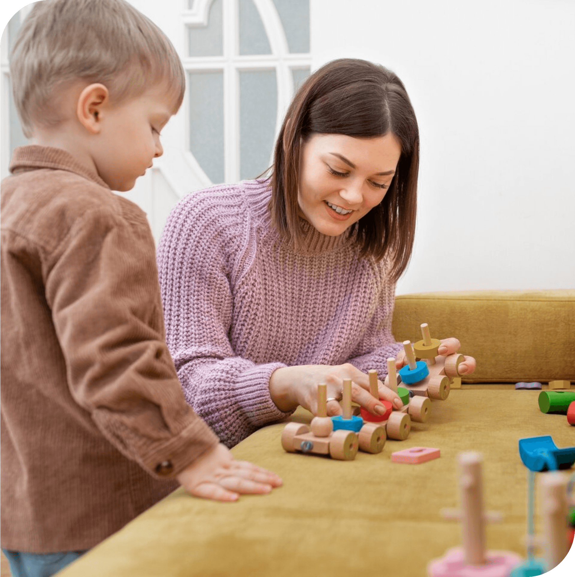 Therapist using play therapy to help a young child with autism develop social skills. Play therapy in Thornhill, Vaughan.